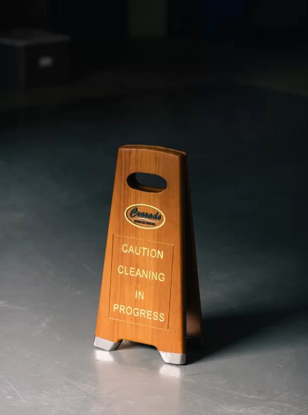 A Crusade ‘Caution — Cleaning in Progress’ sign on a freshly cleaned floor